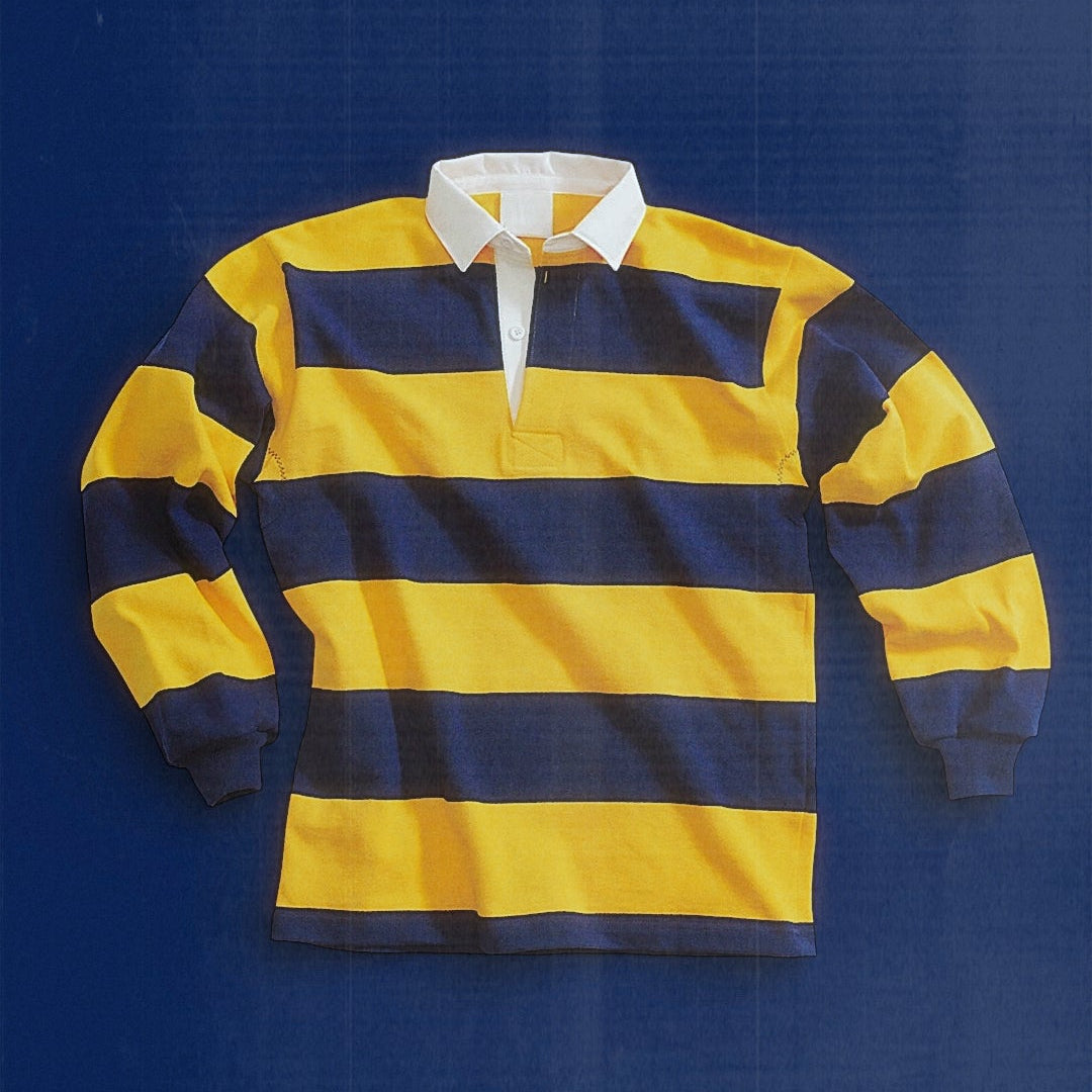 Yellow and navy striped rugby shirt on a blue background Race Committee Bespoke team kits for sailing teams, yacht clubs, and regattas. 