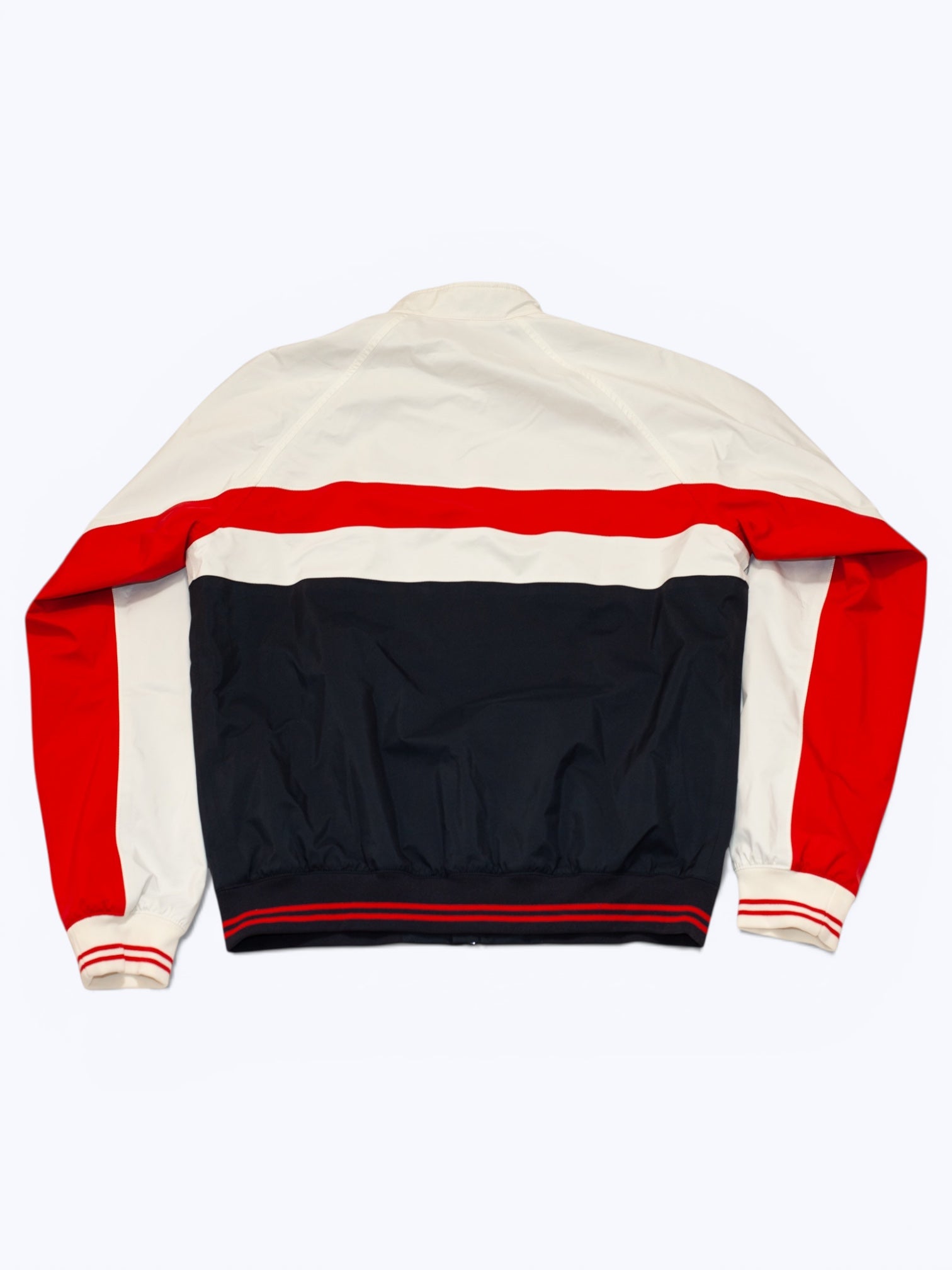 Color-blocked jacket with red, white, and black sections on a white background