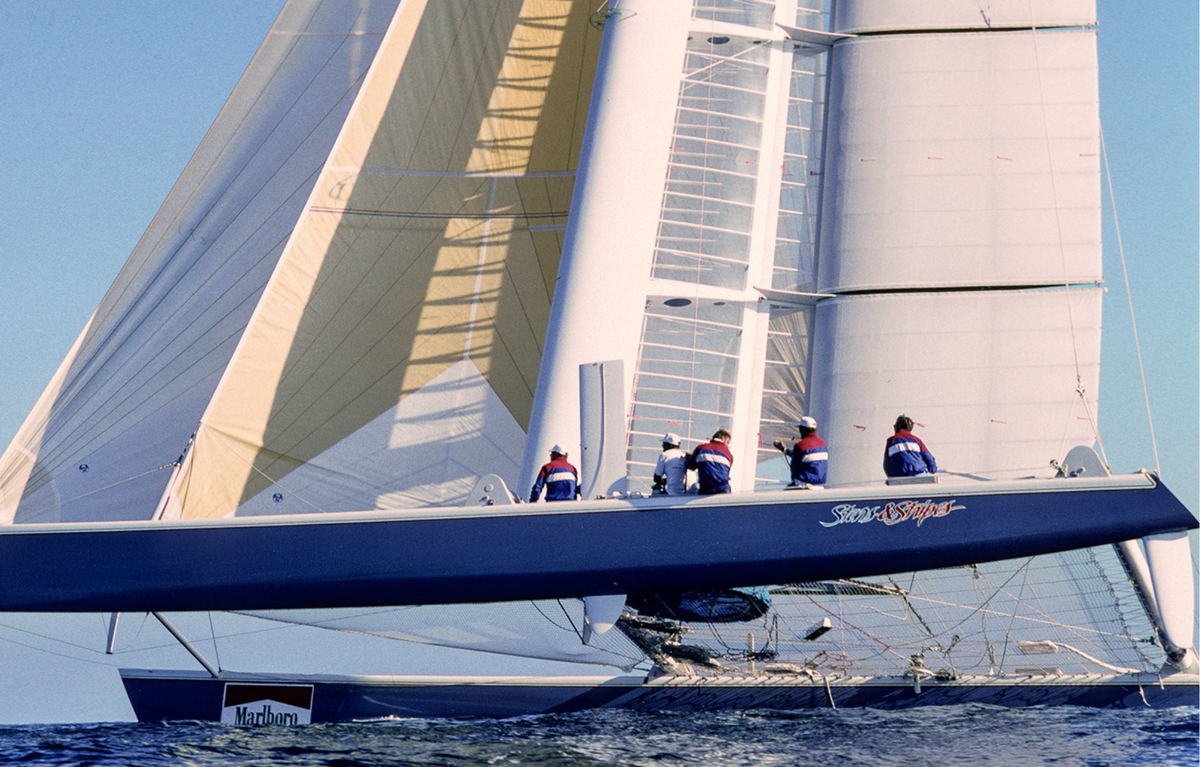 Sailboat with crew on a clear day