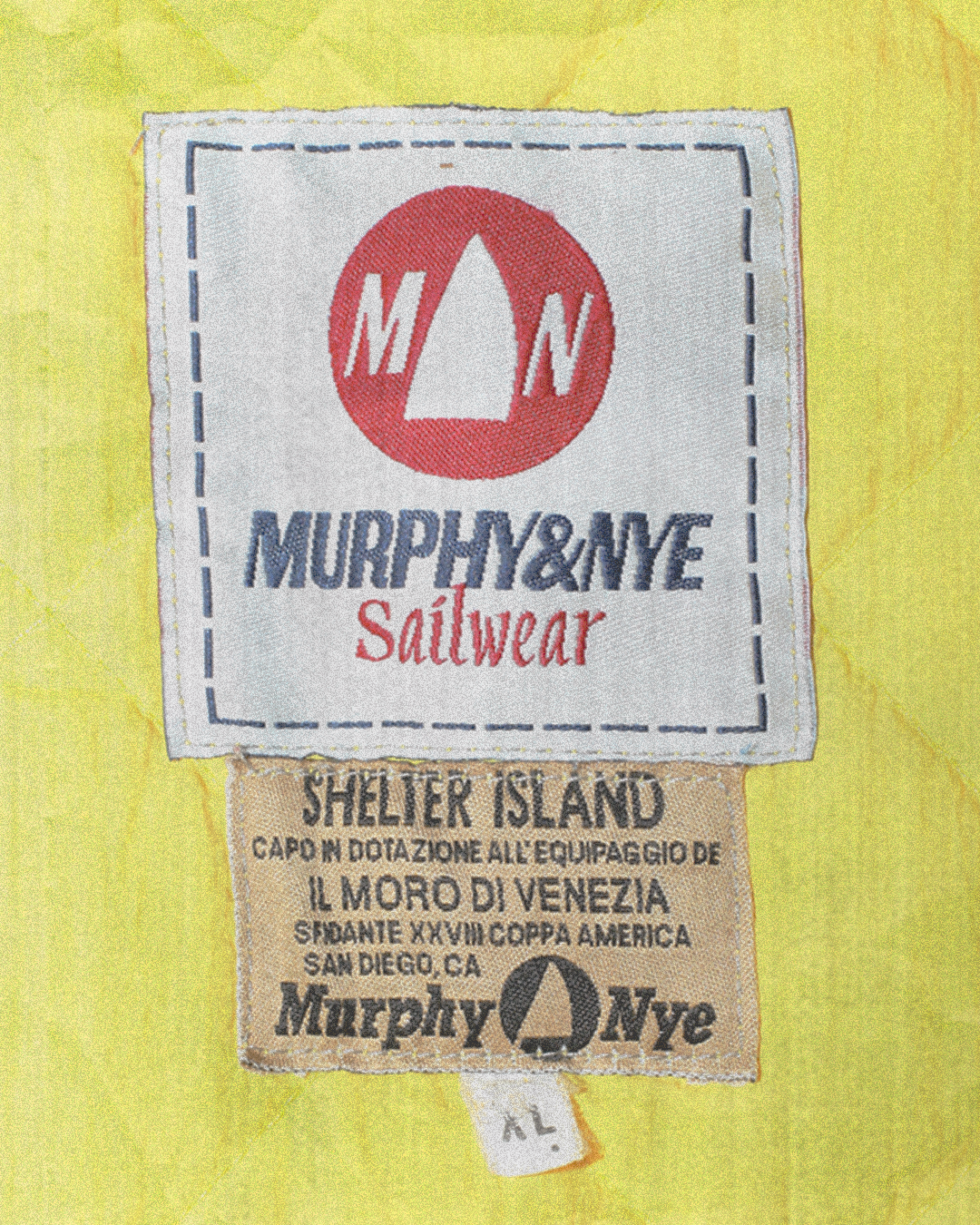 Close-up of Murphy & Nye Sailwear label on a yellow background